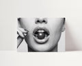 black and white poster print of cherry bomb, cherry between woman's lips