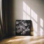 Framed black and white disco party wall art on a wall with sunlight casting shadows