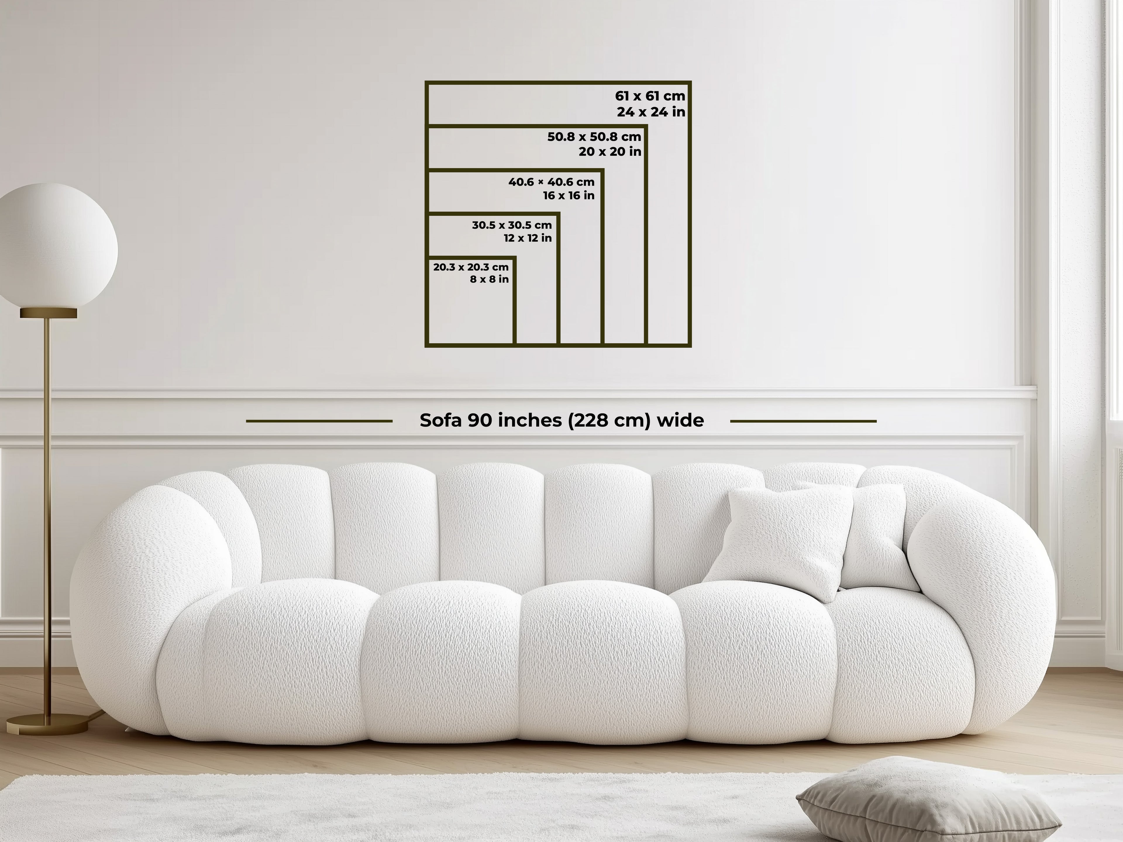 White sofa with dimensions displayed on a wall in a minimalistic room.