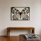 framed black and white poster print hanging over bench in entryway with records sitting on the counter across