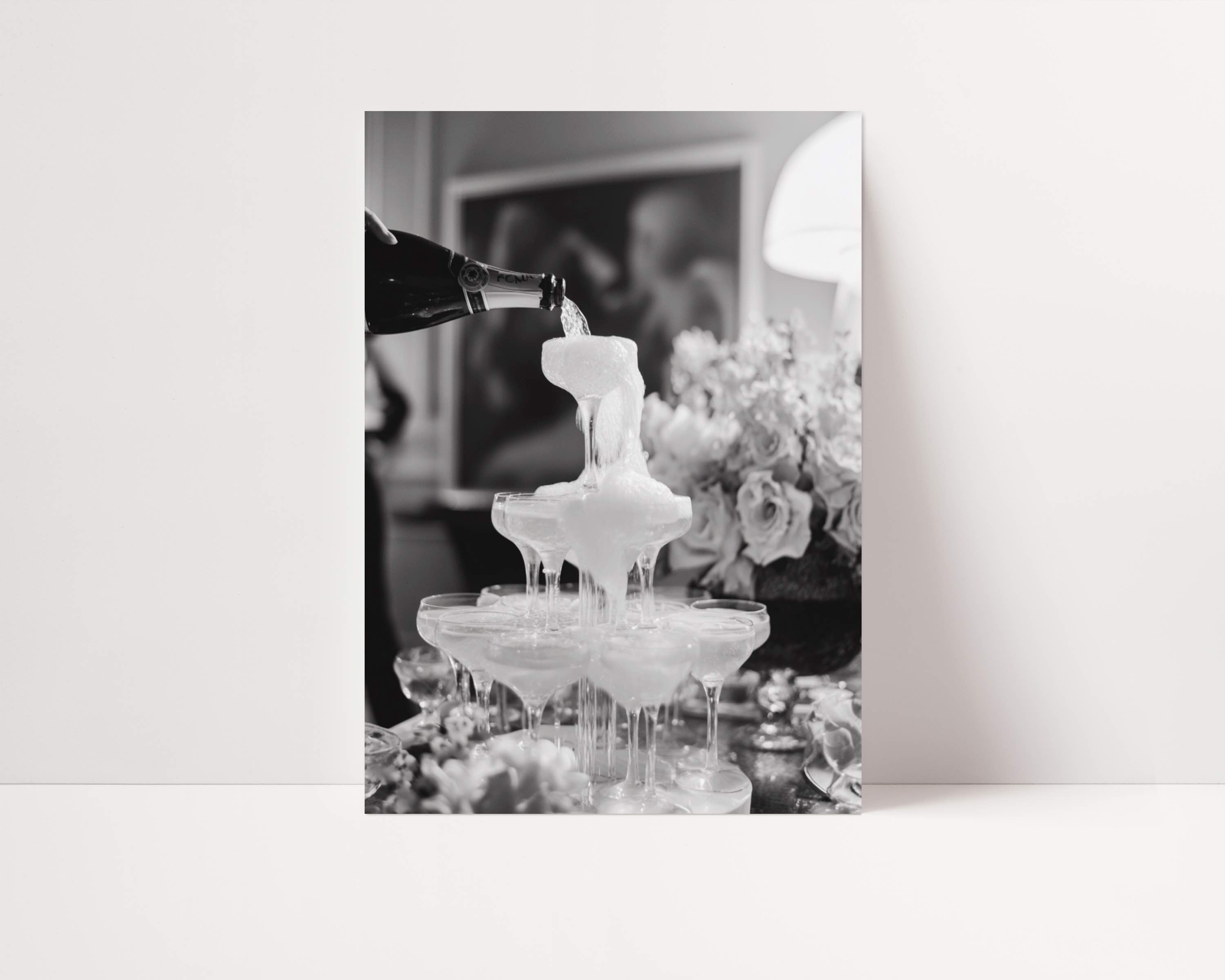 black and white champagne showers vintage glam wall art print leaning against wall