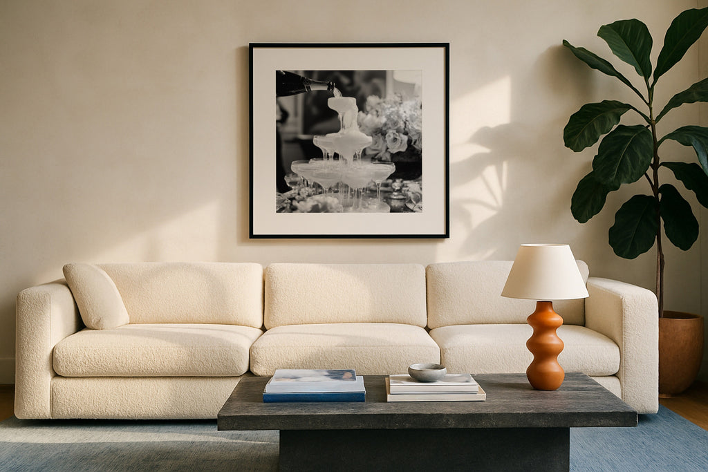 square champagne showers black and white wall art above chic modern couch in living room