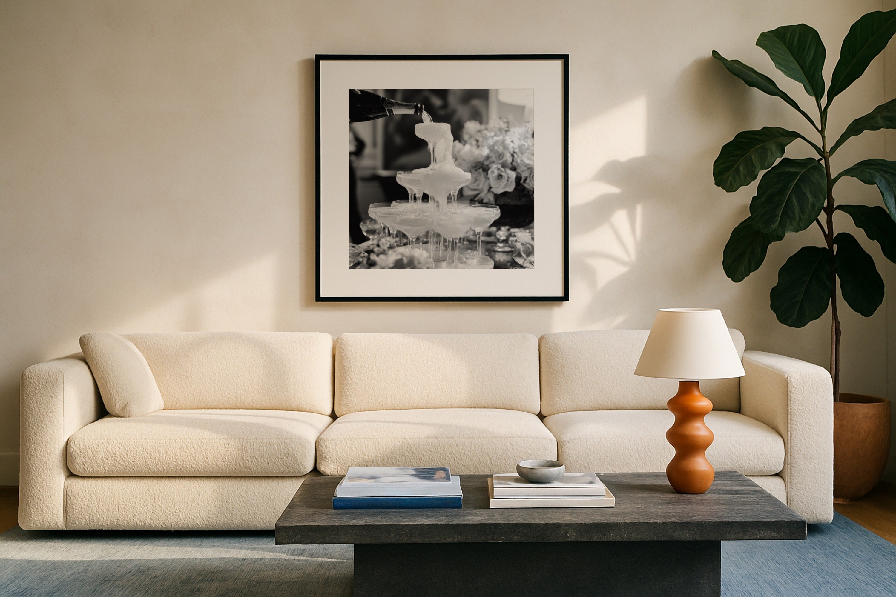 square champagne showers black and white wall art above chic modern couch in living room