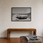 framed black and white Dust & Dreams poster print wall art hanging above bench in entryway