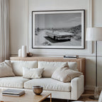 Framed black and white dust and dreams wall art  hanging above white couch in modern living room