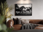 Living room with a brown leather sofa, decorative pillows, and a Framed black and white freedom poster print