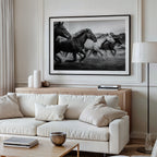 Living room with a white sofa, wooden coffee table, and a framed black and white freedom poster print on the wall.