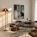 framed kitty kitty black and white poster print hanging above kitchen table in dining room with cheetah accents