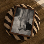framed kitty kitty black and white poster print sitting on zebra ottoman