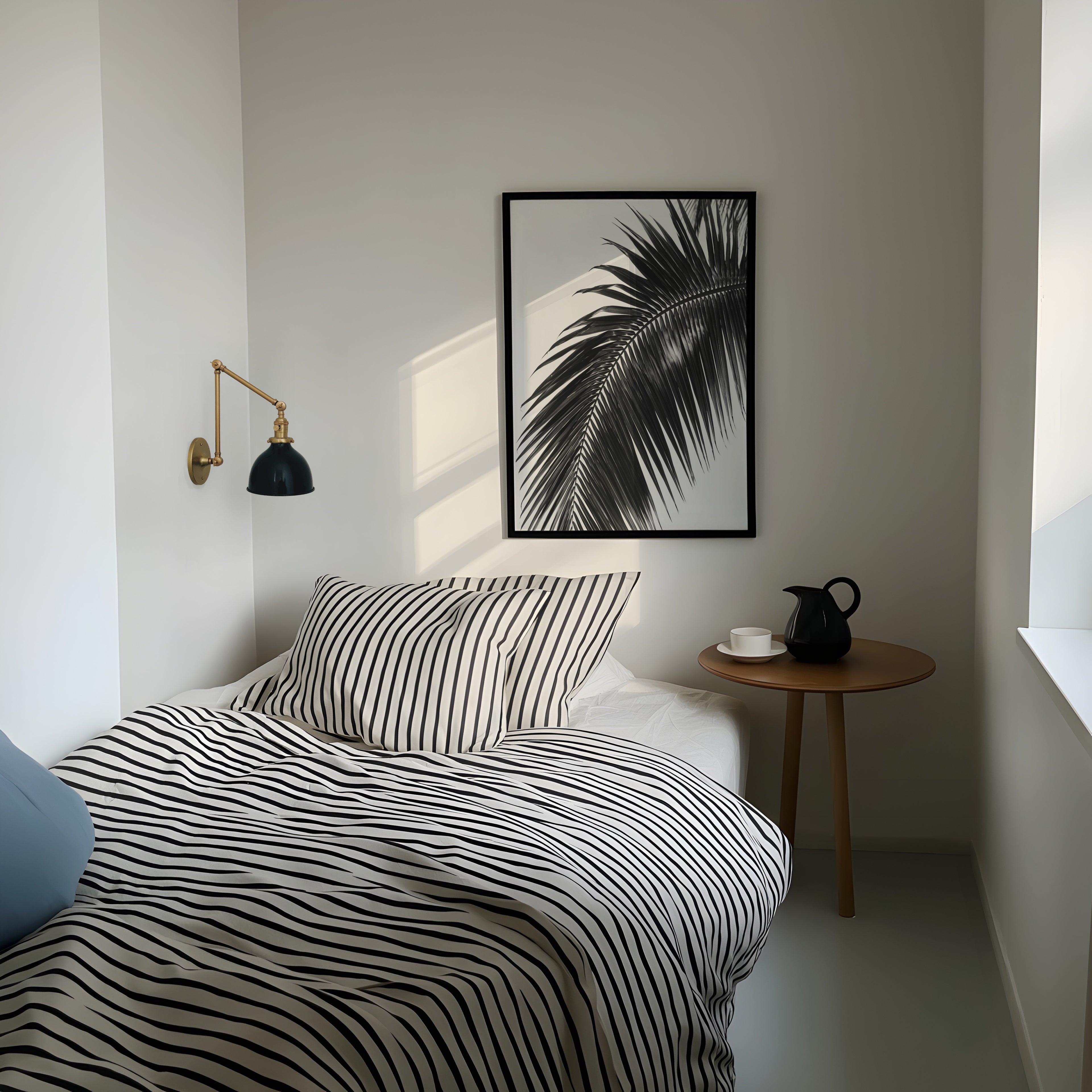 black and white paradise palm poster print hanging above bed