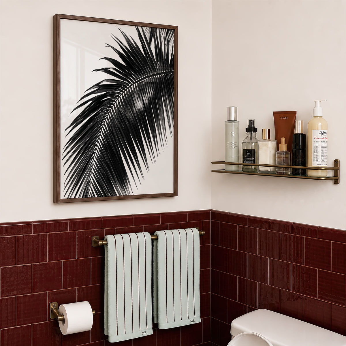 framed black and white paradise palm print hanging in bathroom