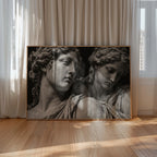 black and white set in stone poster print on floor leaning against windows and curtains