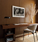 black and white poster print office decor hanging above desk 